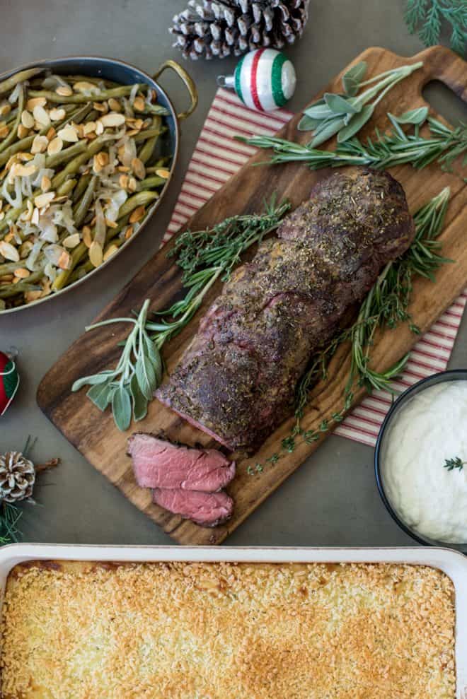 A complete holiday meal of beef tenderloin, green beans and mashed potato casserole