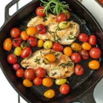 An overhead view of Herbed Brown Butter Chicken with Tomatoes in a pan