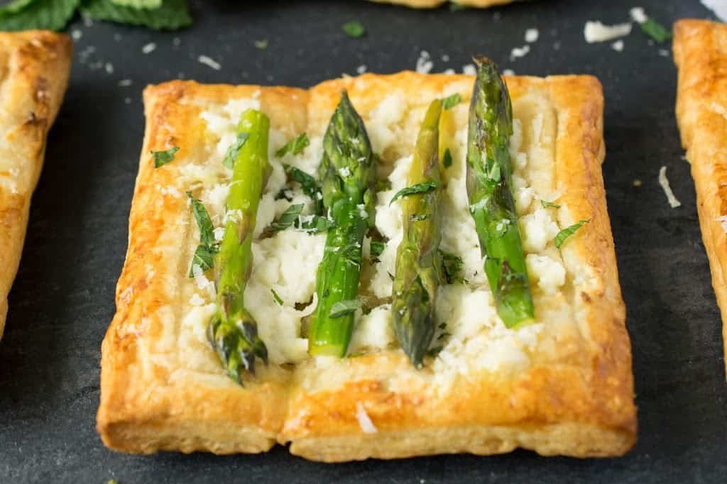 An asparagus and ricotta puff pastry tart