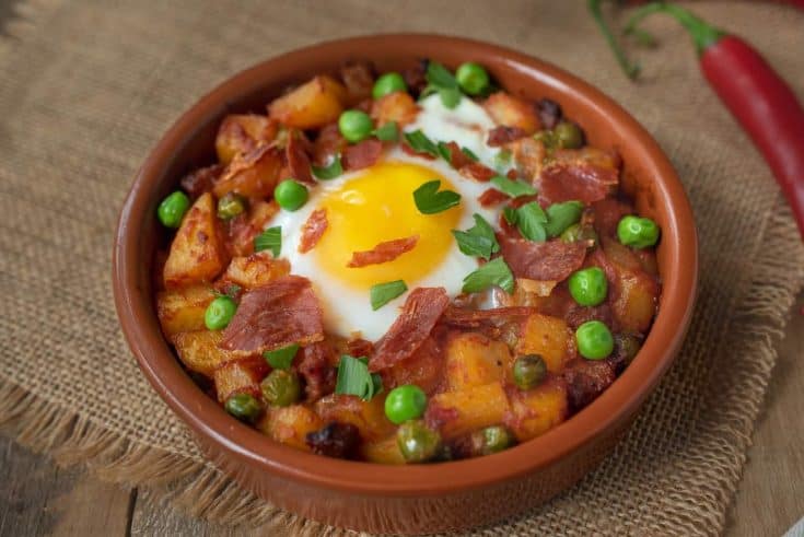 Potatoes, chorizo and peas cooked in a tomato sauce topped with an egg