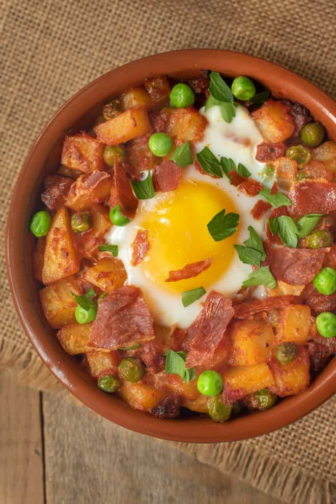 A closeup showing the perfectly cooked egg and green parsley garnish