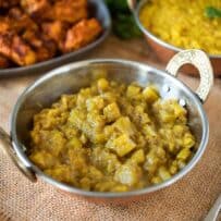 Chunky apple chutney in a sliver bowl