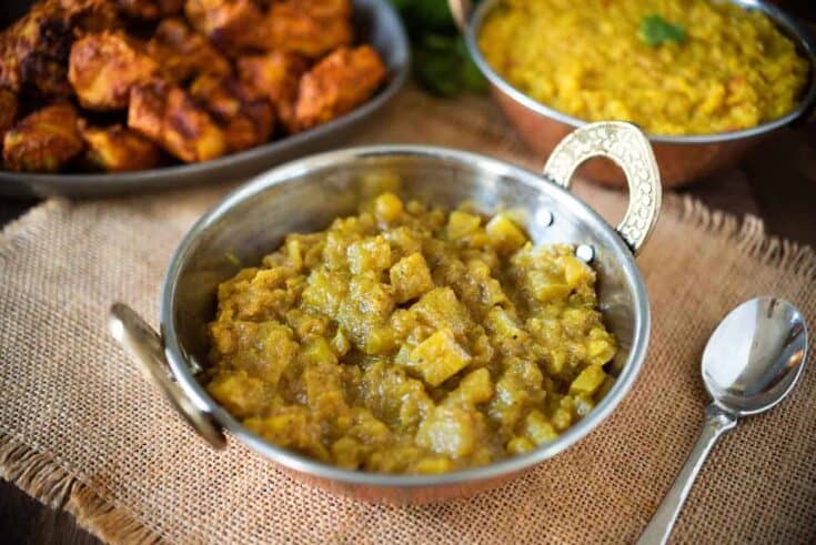 Chunky apple chutney in a sliver bowl