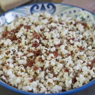 An Italian style decorative bowl filled with popcorn