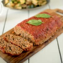 Italian meatloaf coated with pasta sauce