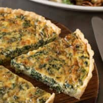 A cut slice of quiche