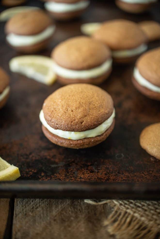 A lemon ginger cream sandwich cookie on a baking sheet