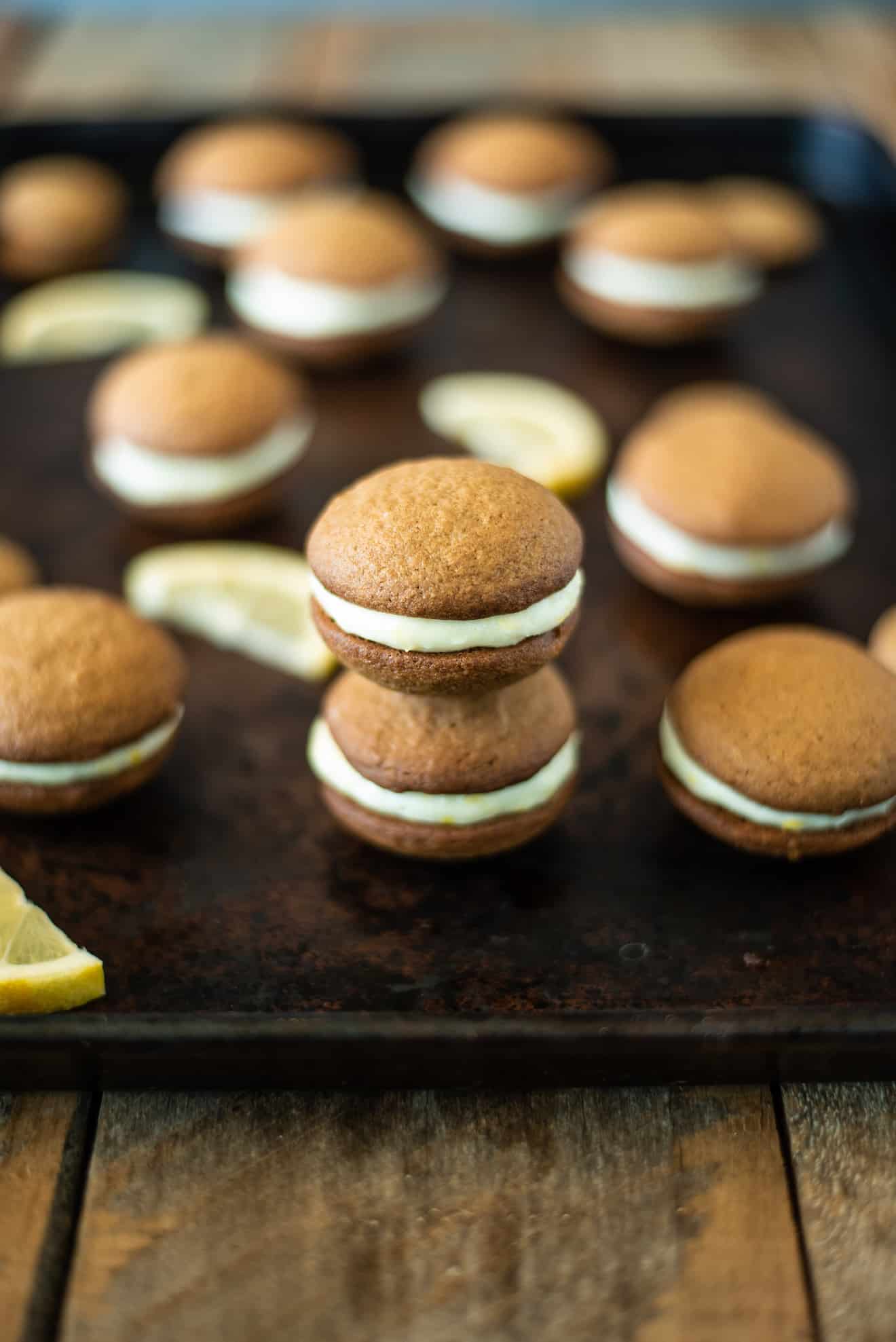 Lemon ginger cream sandwich cookies on a baking sheet