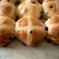 A closeup of lemon hot cross buns