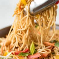 Grabbing noodles with tongs