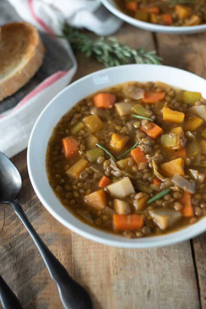 A closeup showing parsnip, butternut squash and carrot in lentil soup