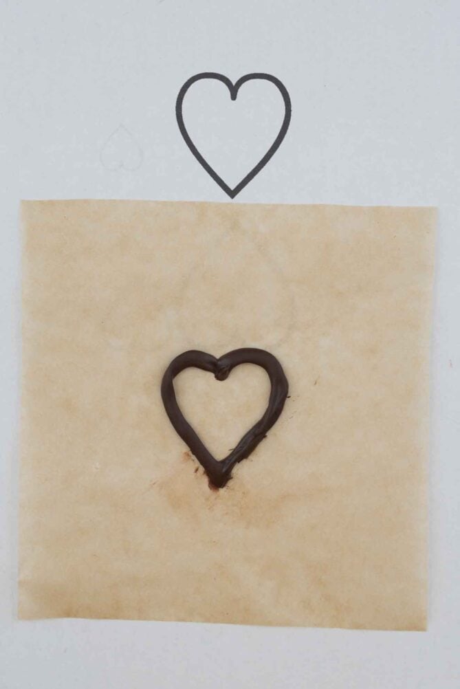 A chocolate heart on parchment paper