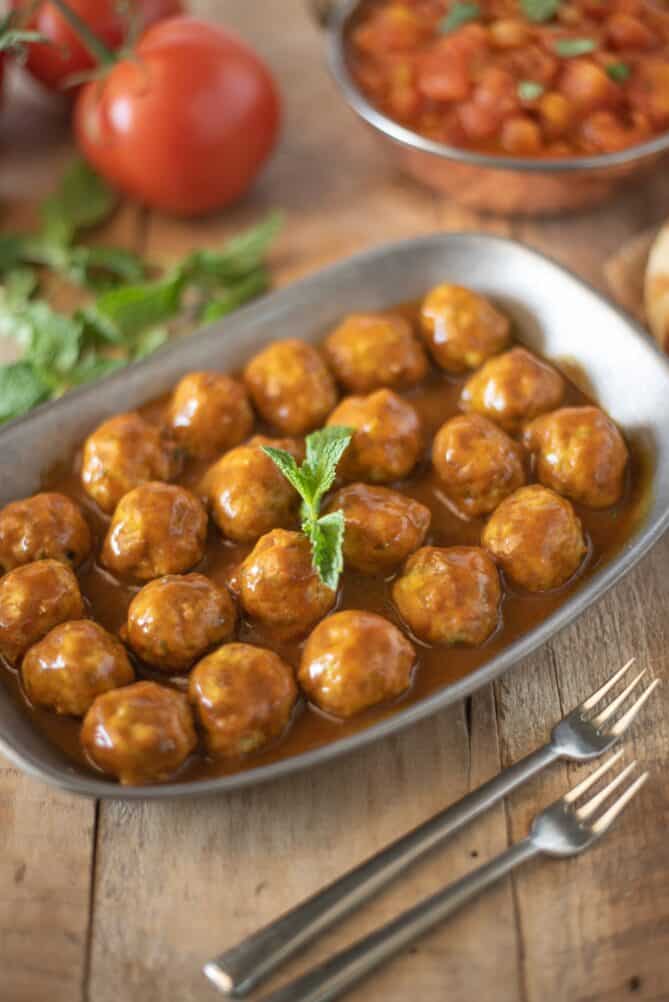 Small chicken meatballs cooked in coconut curry sauce