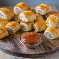 Mini pork, apple & sage sausage rolls with curry ketchup