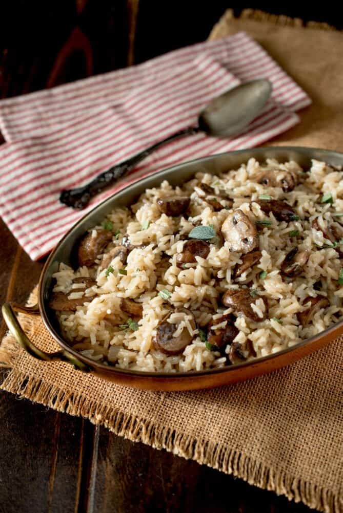 An oval dish filled with mushroom pilaf