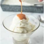 Caramel being poured over ice cream and topped with pecans