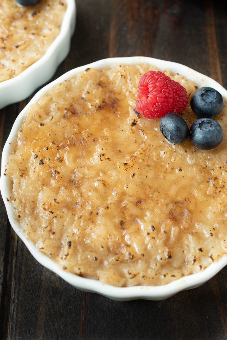 A closeup of the rice pudding with a browned, crispy br&ucirc;l&eacute;ed top