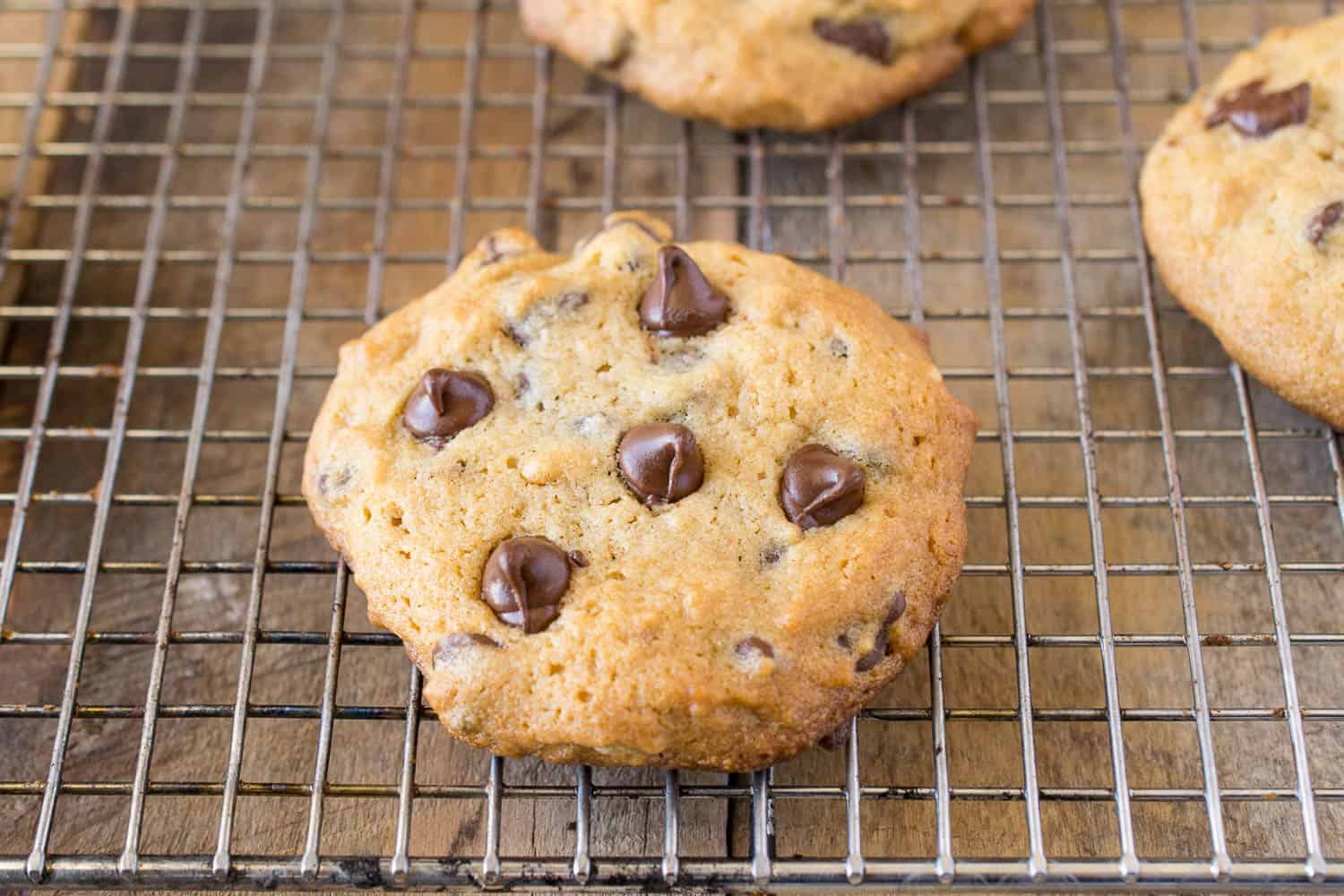 A closeup of a cookie showing the perfectly chocolate chips