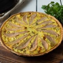 Pear slices fanned on top of a quiche