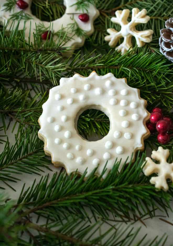 A peppermint sugar cookies decorated with winter white on white frosting