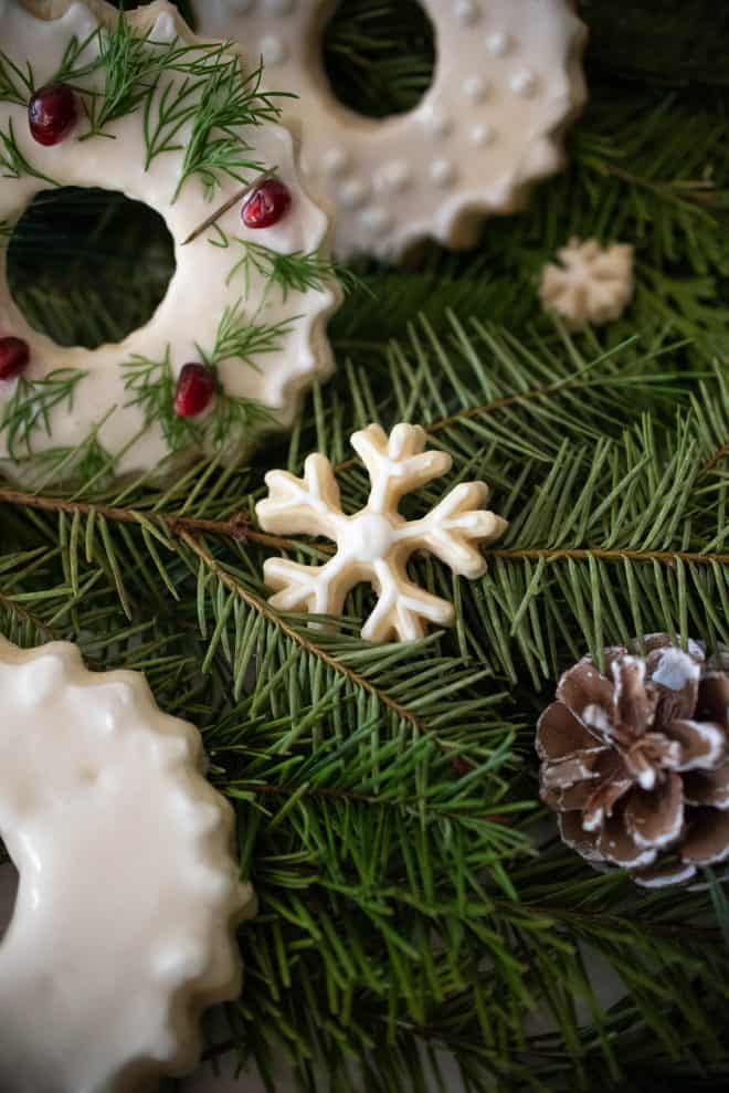 A small snowflake cookie frosted with white icing