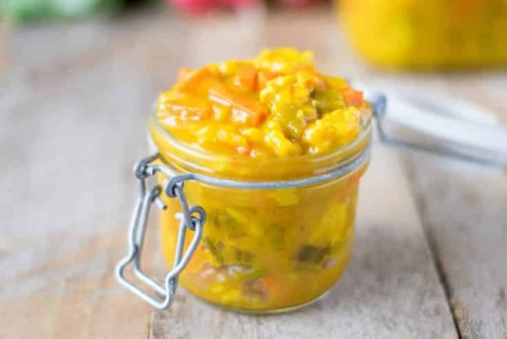 Piccalilli in a jar served with fresh radishes