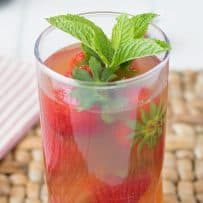 A closeup of Pimm's Strawberry Mint Cockatail