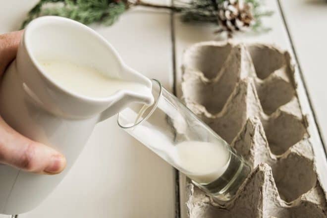 Pouring cream into an angled glass