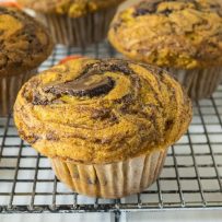 A closeup of a pumpkin muffin showing the nutella swirl