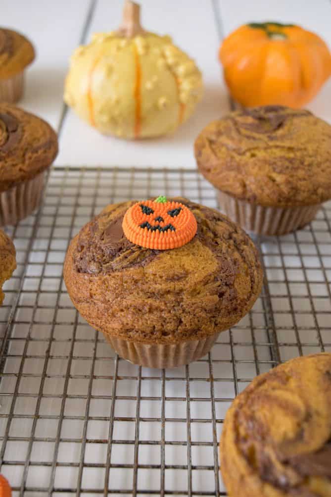 A pumpkin nutella muffin with a candy pumpkin on top