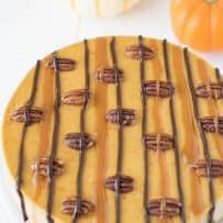 A closeup showing the top with caramel and chocolate and roasted pecans