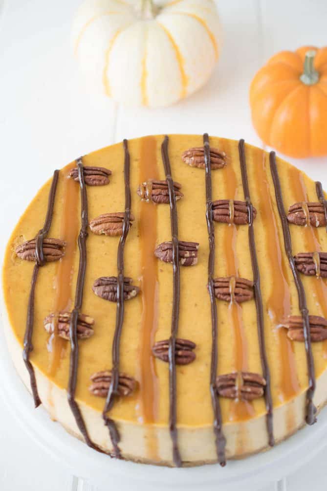 A closeup showing the top with caramel and chocolate and roasted pecans