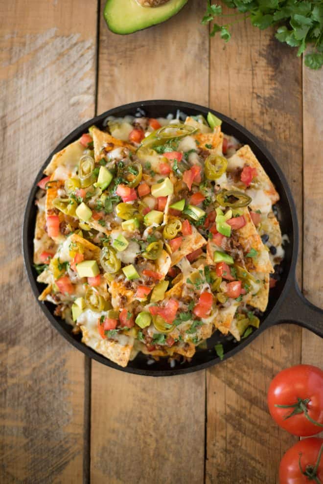 Queso fundido skillet nachos viewed from overhead