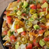 Delicious chorizo, tomato, avocado and jalapeño topping cheese nachos