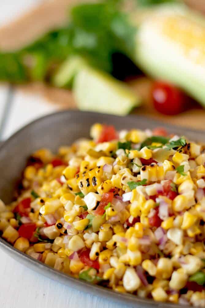 A closeup of grilled corn salsa