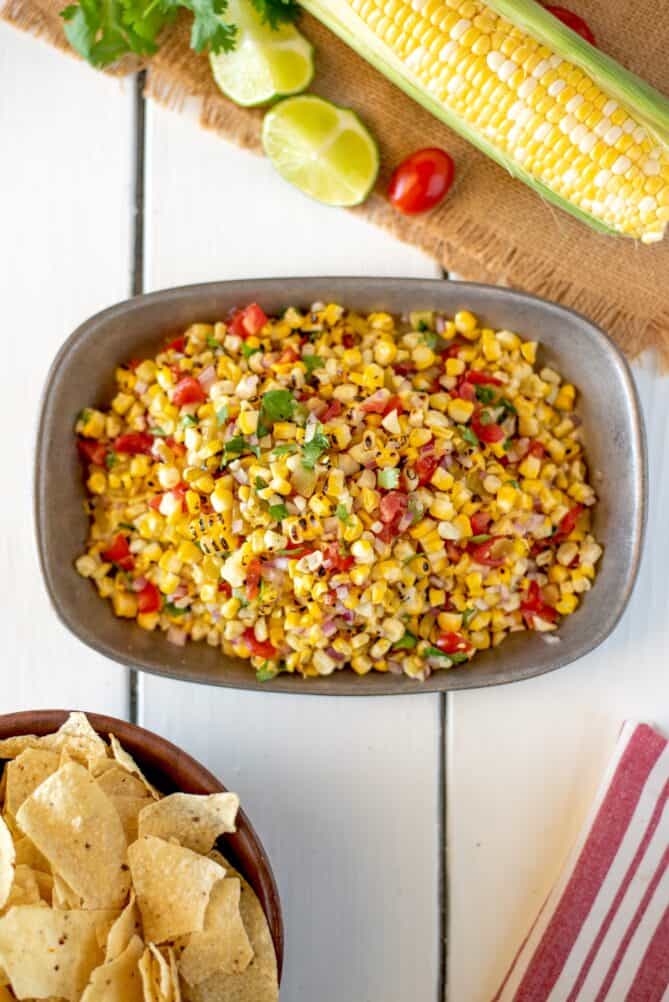 An overhead view of corn salsa in a bowl