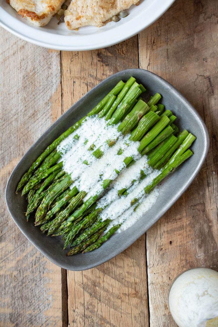 The asparagus from overhead with the sauce