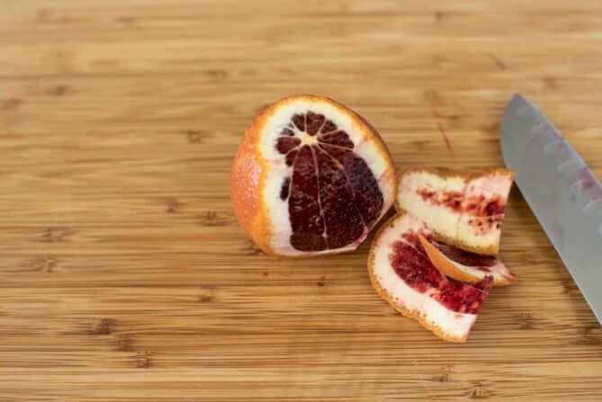 A half peeled blood orange