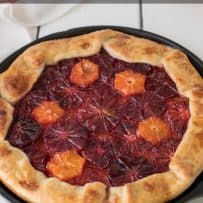 Colorful slices of orange inside a free form tart