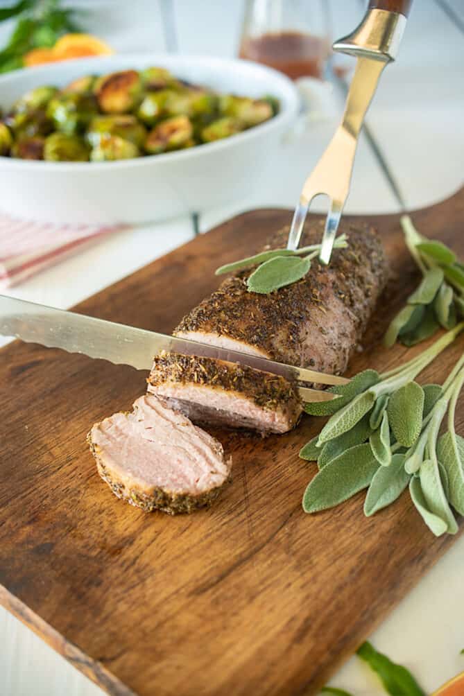 Slicing a sage rubbed pork tenderloin