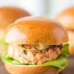 Salmon sliders with caper lemon mayonnaise are delicious, light, summery bites. Fresh salmon is mixed with chives, dill, Dijon mustard and lemon served on mini slider buns and topped with a flavorful mayonnaise.