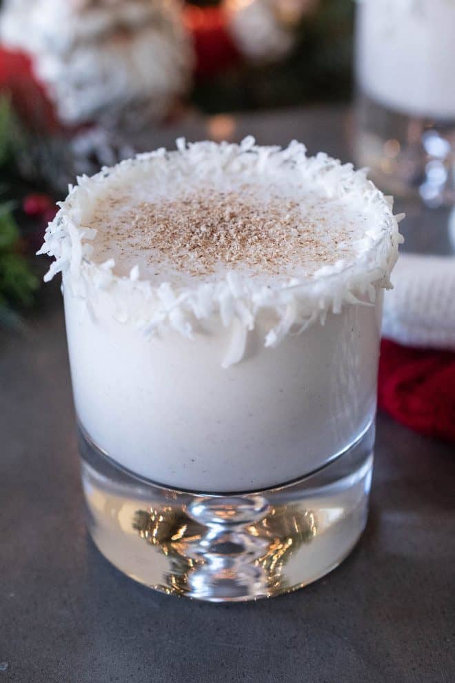 Santa's Rum Spiked Milk with a coconut rim and dusted with nutmeg