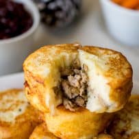 A potato dumpling cut open showing the sausage inside