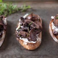 3 sautéed mushroom and rosemary bruschetta on a serving platter