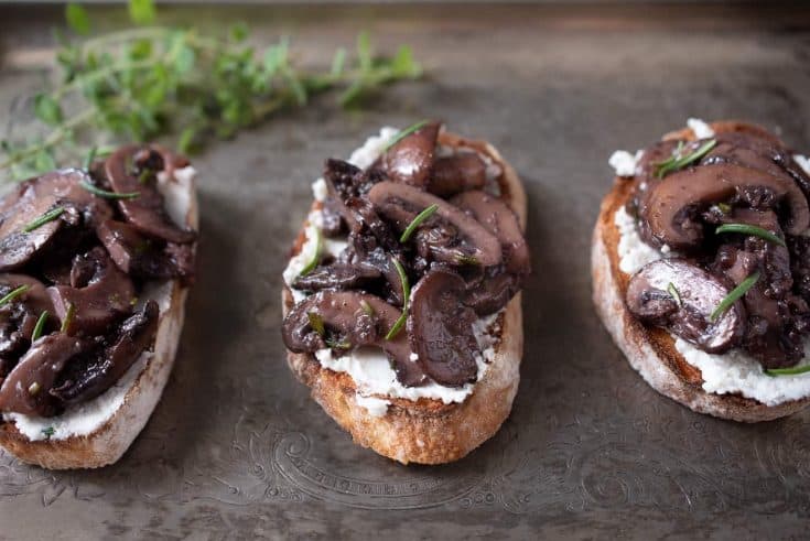 3 saut&eacute;ed mushroom and rosemary bruschetta on a serving platter