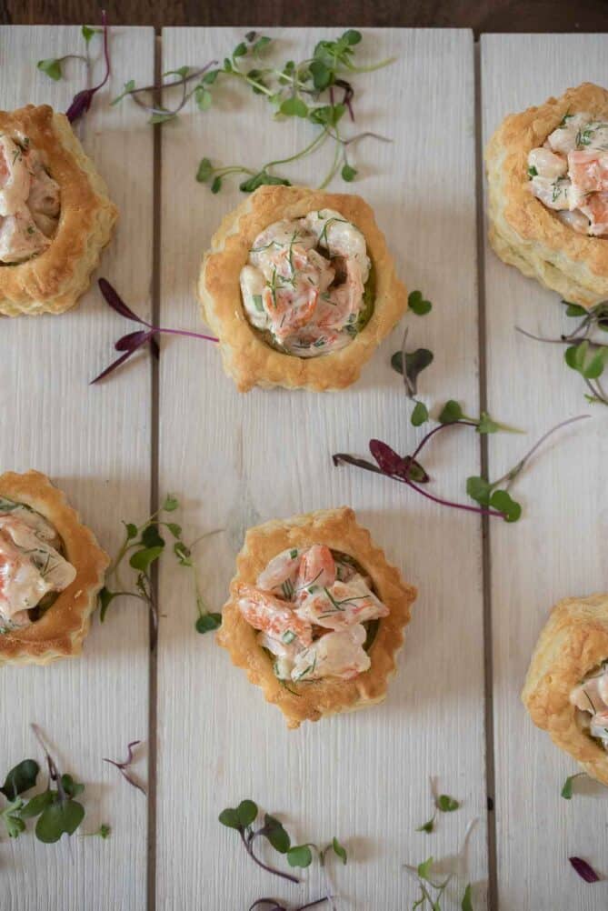 An overhead view of shrimp salad and avocado filled puff pastry shells