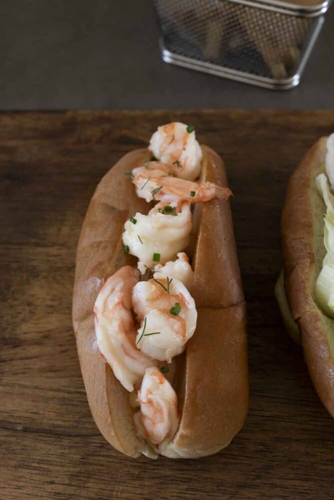 Shrimp poached in butter inside a lobster roll bun