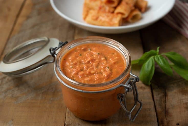 A jar filled with Sicilian Tomato Pesto Sauce