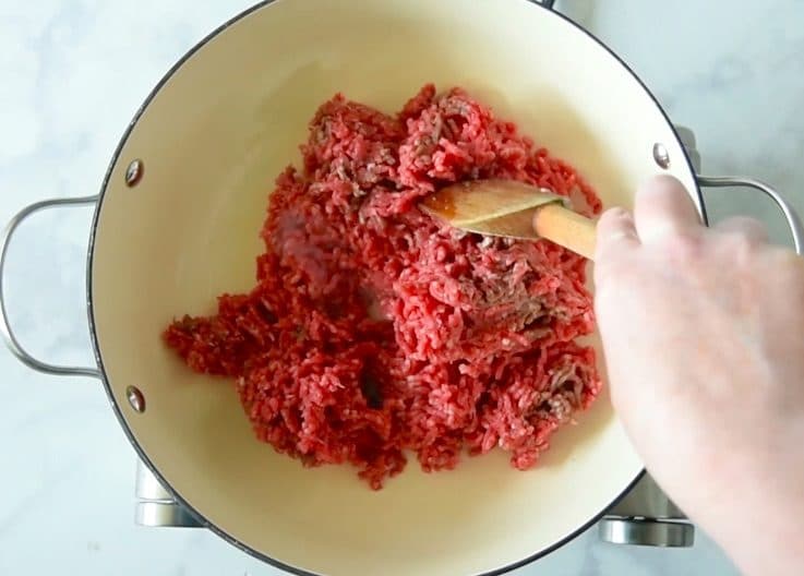 Ground beef is browned in a pan