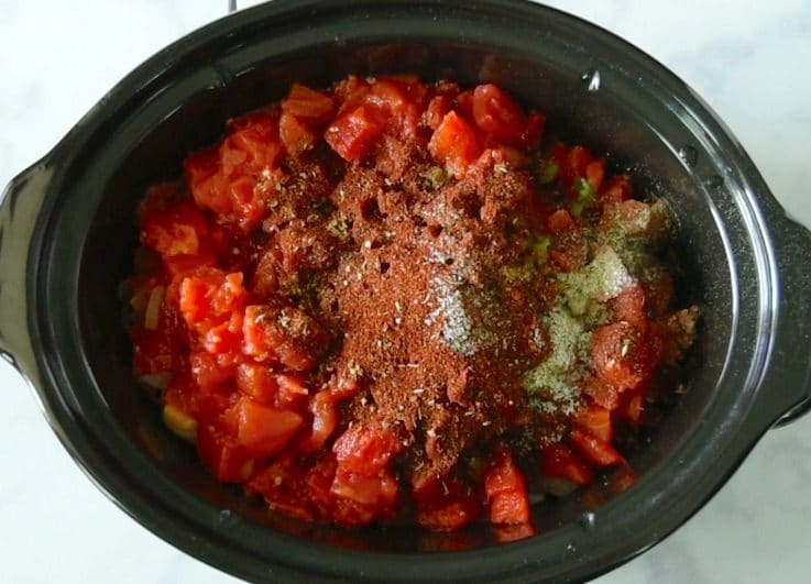 Cumin, coriander, oregano, chili powder, salt & pepper are added